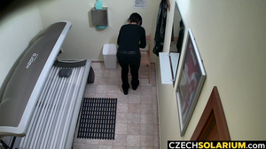 Horny amateur fingers herself in a tanning bed